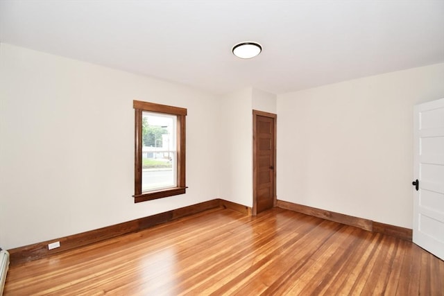 130 Center St, Ludlow, MA 01056 - spare room with baseboards, light wood finished floors, and a baseboard heating unit