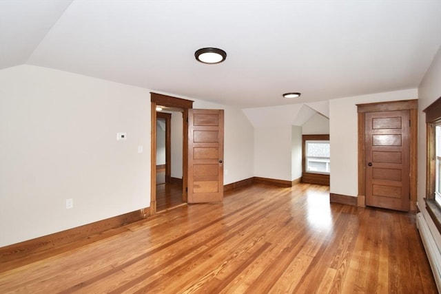 130 Center St, Ludlow, MA 01056 - bonus room with a baseboard heating unit, lofted ceiling, light wood-style floors, and baseboards