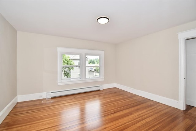 130 Center St, Ludlow, MA 01056 - spare room with a baseboard radiator, light wood finished floors, and baseboards
