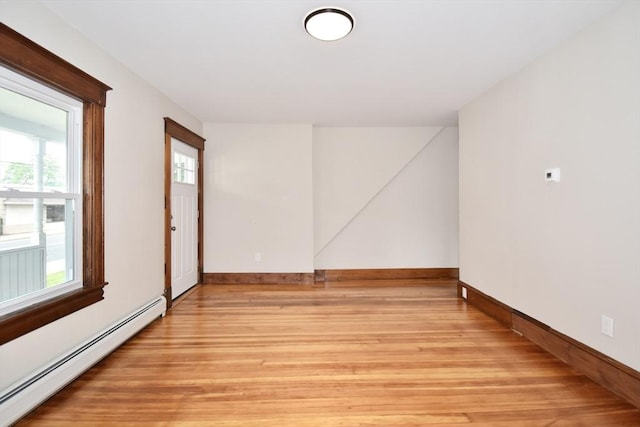 130 Center St, Ludlow, MA 01056 - spare room with baseboard heating, light wood finished floors, and baseboards