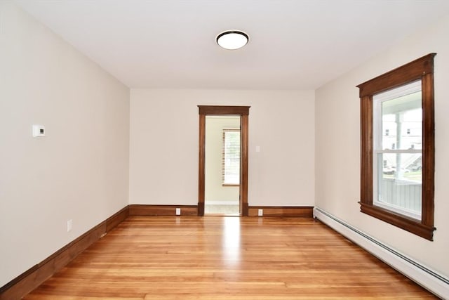 130 Center St, Ludlow, MA 01056 - spare room featuring a baseboard radiator, plenty of natural light, light wood-style flooring, and baseboards