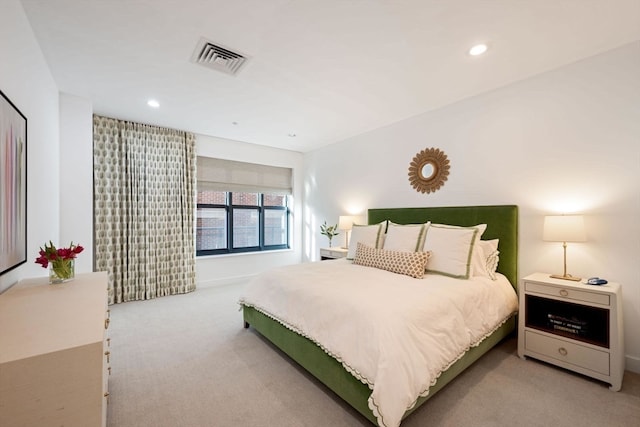 bedroom featuring light carpet