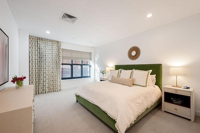 carpeted bedroom with visible vents and recessed lighting
