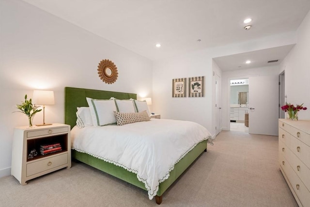 bedroom featuring connected bathroom, recessed lighting, light colored carpet, and visible vents