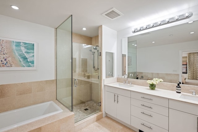 bathroom with vanity, separate shower and tub, and tile patterned flooring