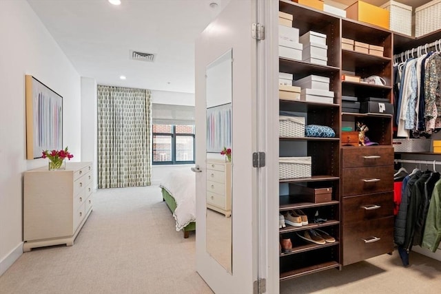 spacious closet featuring carpet flooring and visible vents
