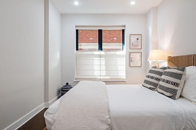 bedroom featuring recessed lighting, baseboards, and wood finished floors