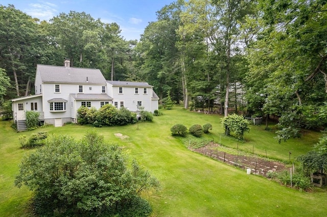 19 Birch St, Millis, MA 02054 - view of grassy yard with a vegetable garden