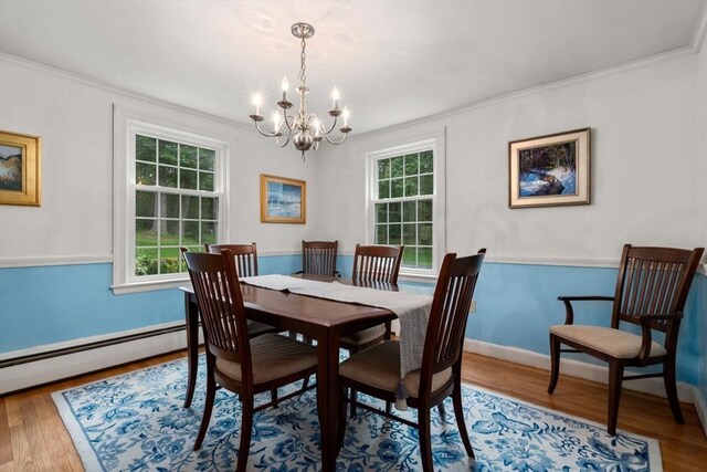 19 Birch St, Millis, MA 02054 - dining room featuring a chandelier, crown molding, plenty of natural light, and wood finished floors