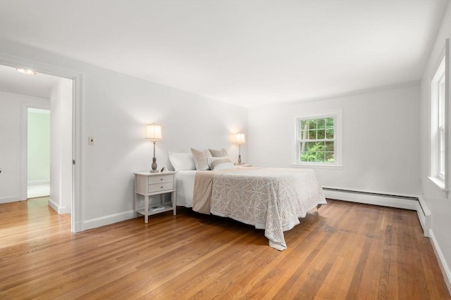 19 Birch St, Millis, MA 02054 - bedroom featuring light wood finished floors and a baseboard radiator