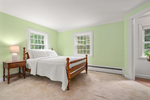 19 Birch St, Millis, MA 02054 - bedroom featuring a baseboard radiator, multiple windows, and light colored carpet