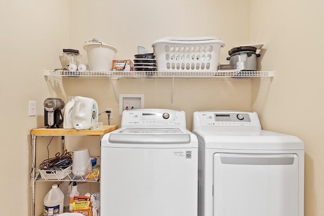 laundry room featuring laundry area and washing machine and clothes dryer