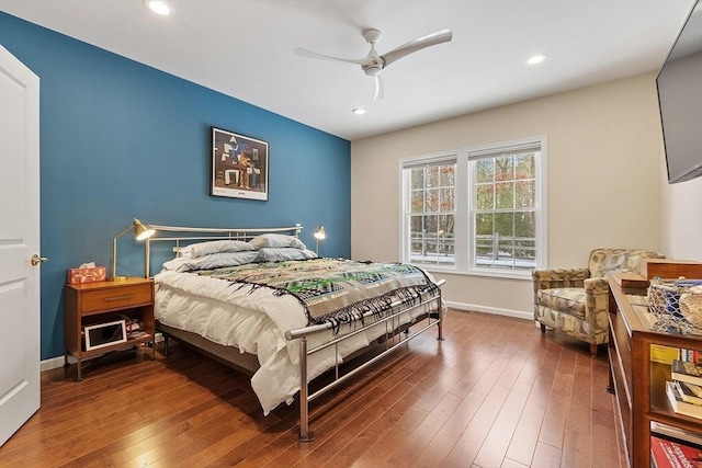 bedroom featuring dark wood-style flooring, recessed lighting, and baseboards