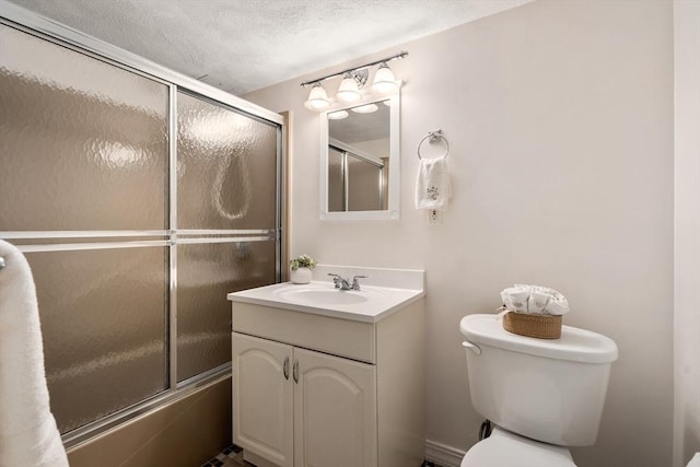 full bathroom with toilet, vanity, a textured ceiling, and combined bath / shower with glass door