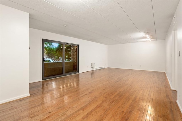 empty room featuring hardwood / wood-style flooring