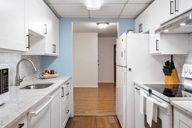 kitchen with white cabinetry, white range with electric stovetop, backsplash, a paneled ceiling, and sink