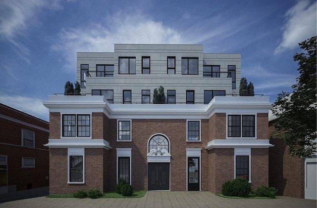 view of front of home featuring brick siding