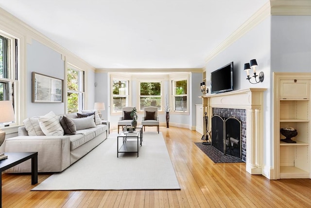 10 Eliot Rd, Lexington, MA 02421 - living area with light wood finished floors, ornamental molding, and a tiled fireplace