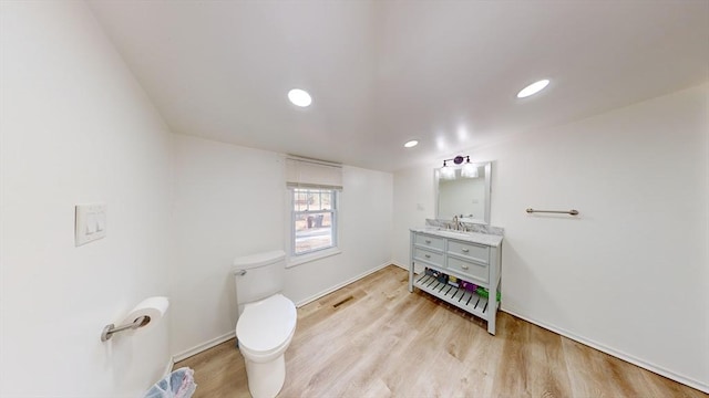 95 Prospect Street Ext, Westfield, MA 01085 - bathroom featuring vanity, wood-type flooring, and toilet