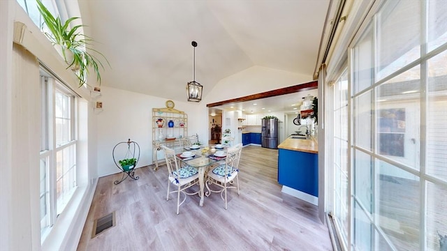 95 Prospect Street Ext, Westfield, MA 01085 - dining space featuring sink, light hardwood / wood-style floors, and vaulted ceiling