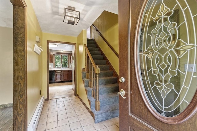 146 Lowell Rd, Pepperell, MA 01463 - entryway featuring baseboard heating, stairs, and light tile patterned floors