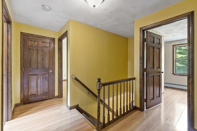 146 Lowell Rd, Pepperell, MA 01463 - entrance foyer featuring light wood finished floors and a baseboard heating unit