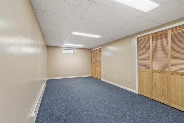 146 Lowell Rd, Pepperell, MA 01463 - unfurnished bedroom with baseboard heating, two closets, dark carpet, and a drop ceiling