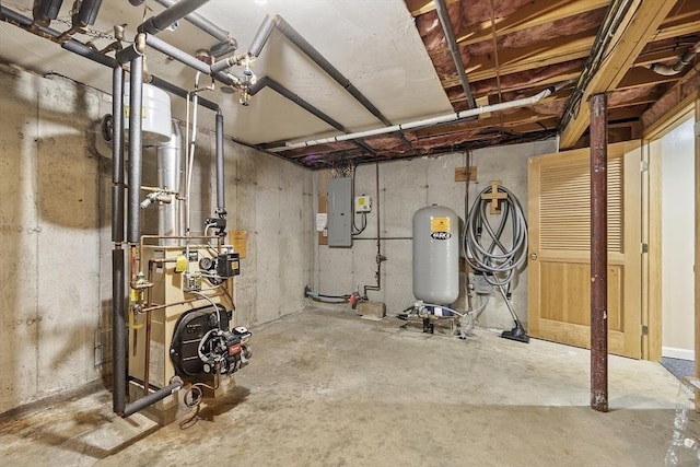 146 Lowell Rd, Pepperell, MA 01463 - unfinished below grade area featuring a water pressure tank and electric panel