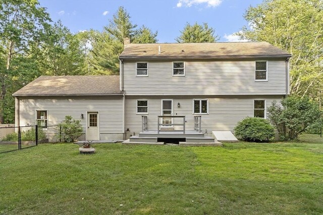146 Lowell Rd, Pepperell, MA 01463 - rear view of house with a deck, a shingled roof, and a chimney