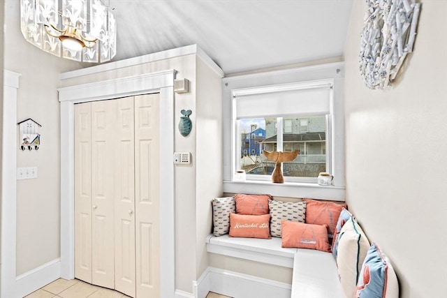 tiled entryway with baseboards