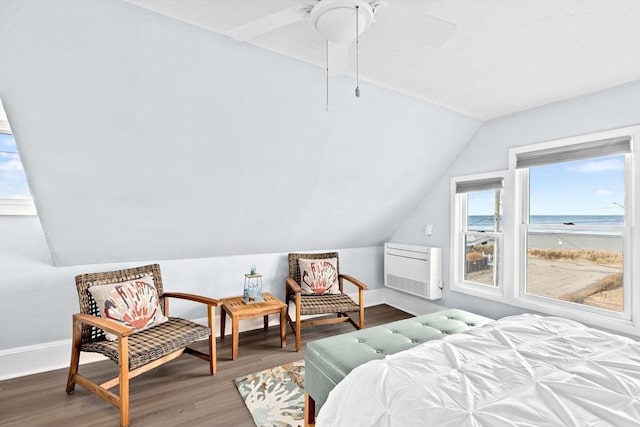 bedroom with a ceiling fan, lofted ceiling, baseboards, and wood finished floors