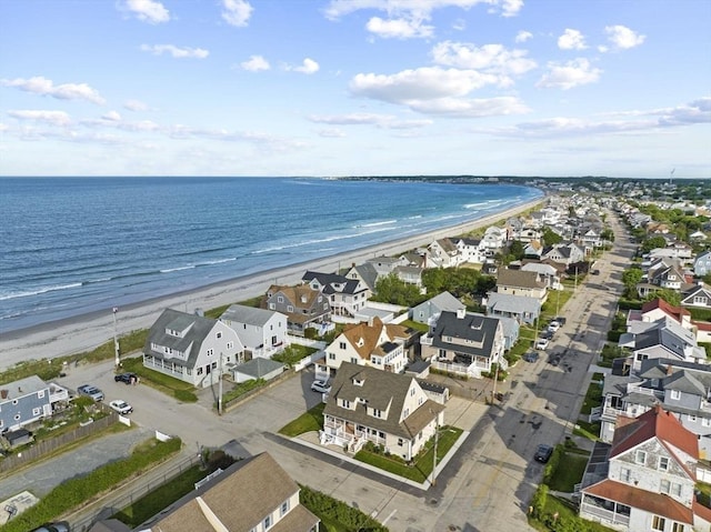 birds eye view of property with a beach view, a residential view, and a water view