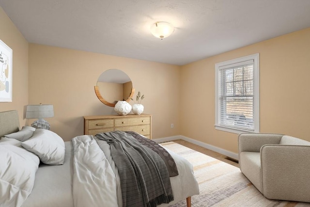 bedroom featuring visible vents, carpet flooring, and baseboards