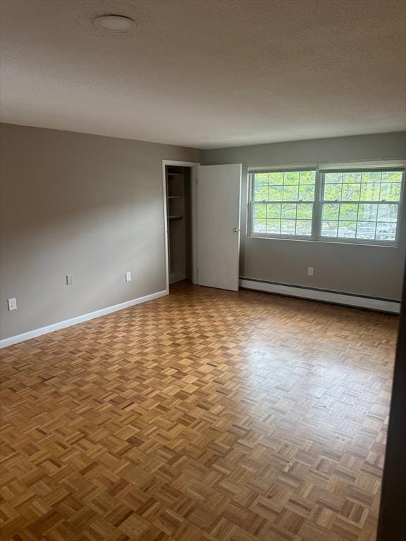 60A Washington Park Dr Unit 3, Andover, MA 01810 - spare room featuring baseboard heating and baseboards