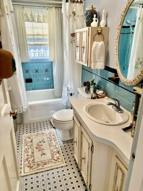 6 Damon Rd, Scituate, MA 02066 - full bathroom featuring tile patterned flooring, vanity, toilet, and shower / bathtub combination with curtain