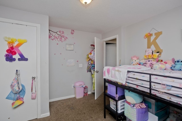 carpeted bedroom featuring a textured ceiling