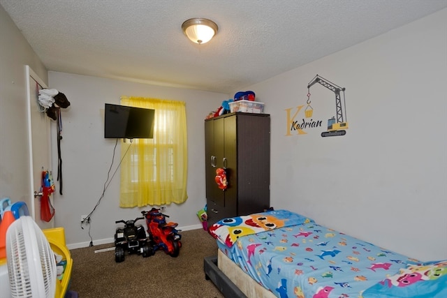 carpeted bedroom with a textured ceiling