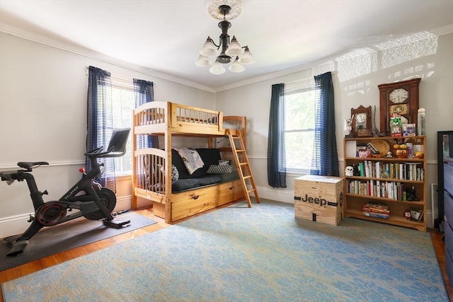 327 Lafayette St Unit 2, Salem, MA 01970 - bedroom with a chandelier, multiple windows, wood finished floors, and ornamental molding