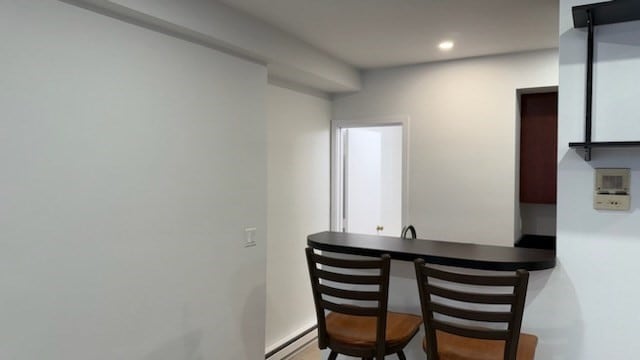 dining space with a baseboard heating unit