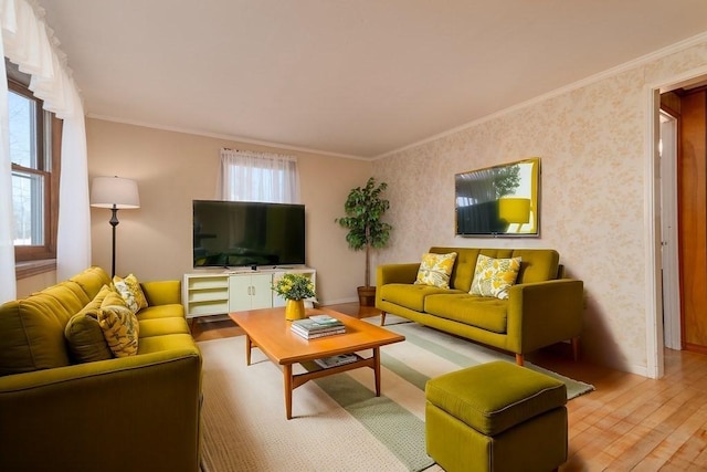 living room with ornamental molding and wood finished floors