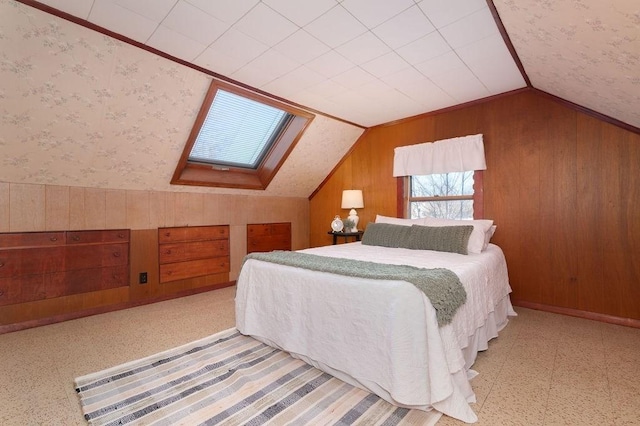 bedroom with wallpapered walls, lofted ceiling, wooden walls, and tile patterned floors