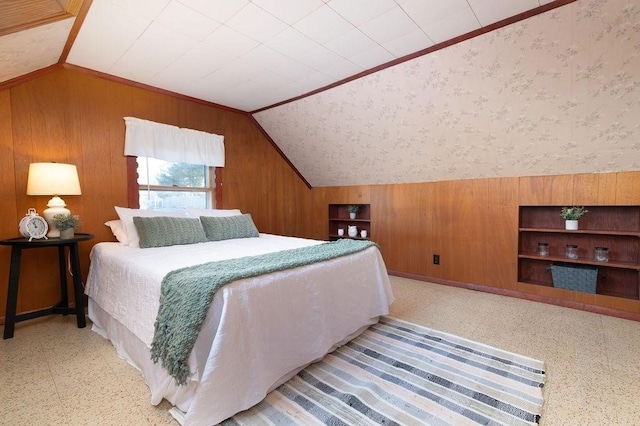 bedroom with wallpapered walls, vaulted ceiling, and wooden walls