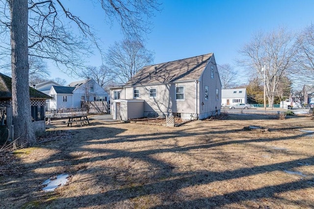 back of house featuring fence