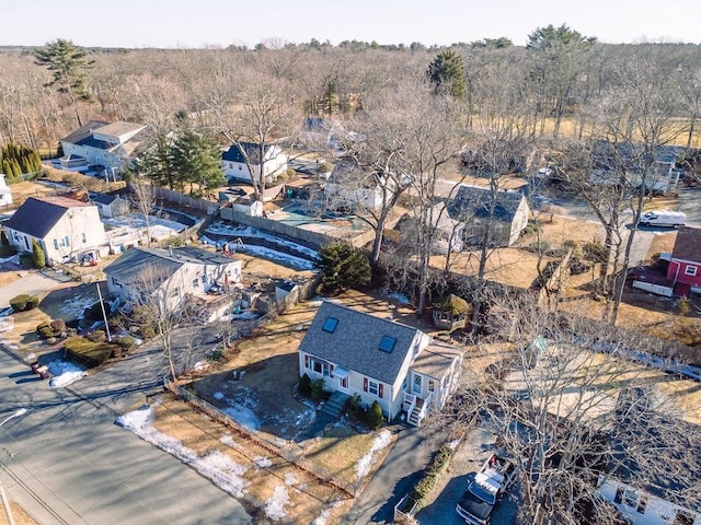 birds eye view of property featuring a view of trees