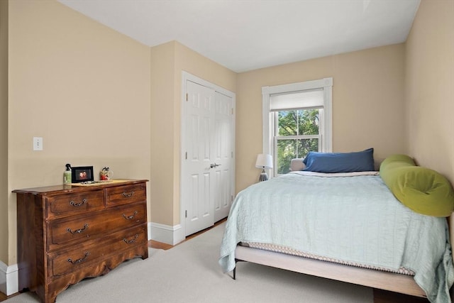 35 Harvard St, Winchester, MA 01890 - bedroom with baseboards, a closet, and carpet floors