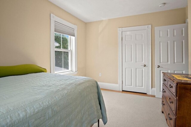 35 Harvard St, Winchester, MA 01890 - bedroom featuring light colored carpet and baseboards