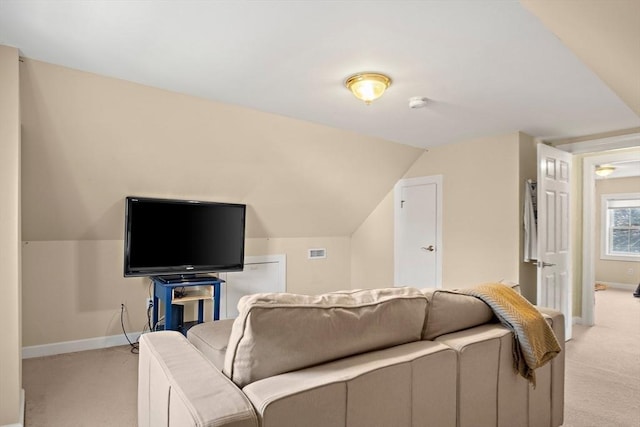 35 Harvard St, Winchester, MA 01890 - living room with light colored carpet, baseboards, and vaulted ceiling