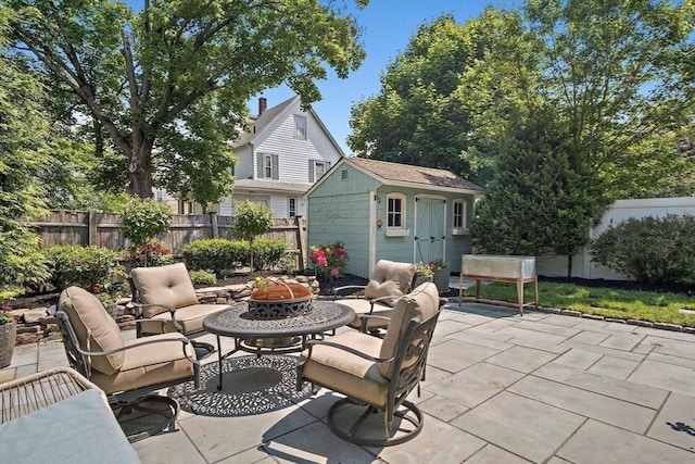 35 Harvard St, Winchester, MA 01890 - fenced backyard featuring a patio area and an outdoor living space with a fire pit