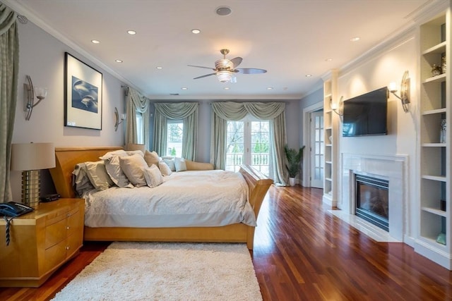 bedroom featuring dark hardwood / wood-style flooring, ceiling fan, access to outside, and crown molding