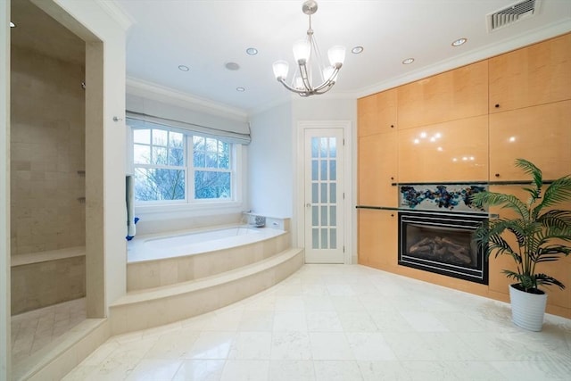 bathroom featuring ornamental molding, a bathtub, and an inviting chandelier